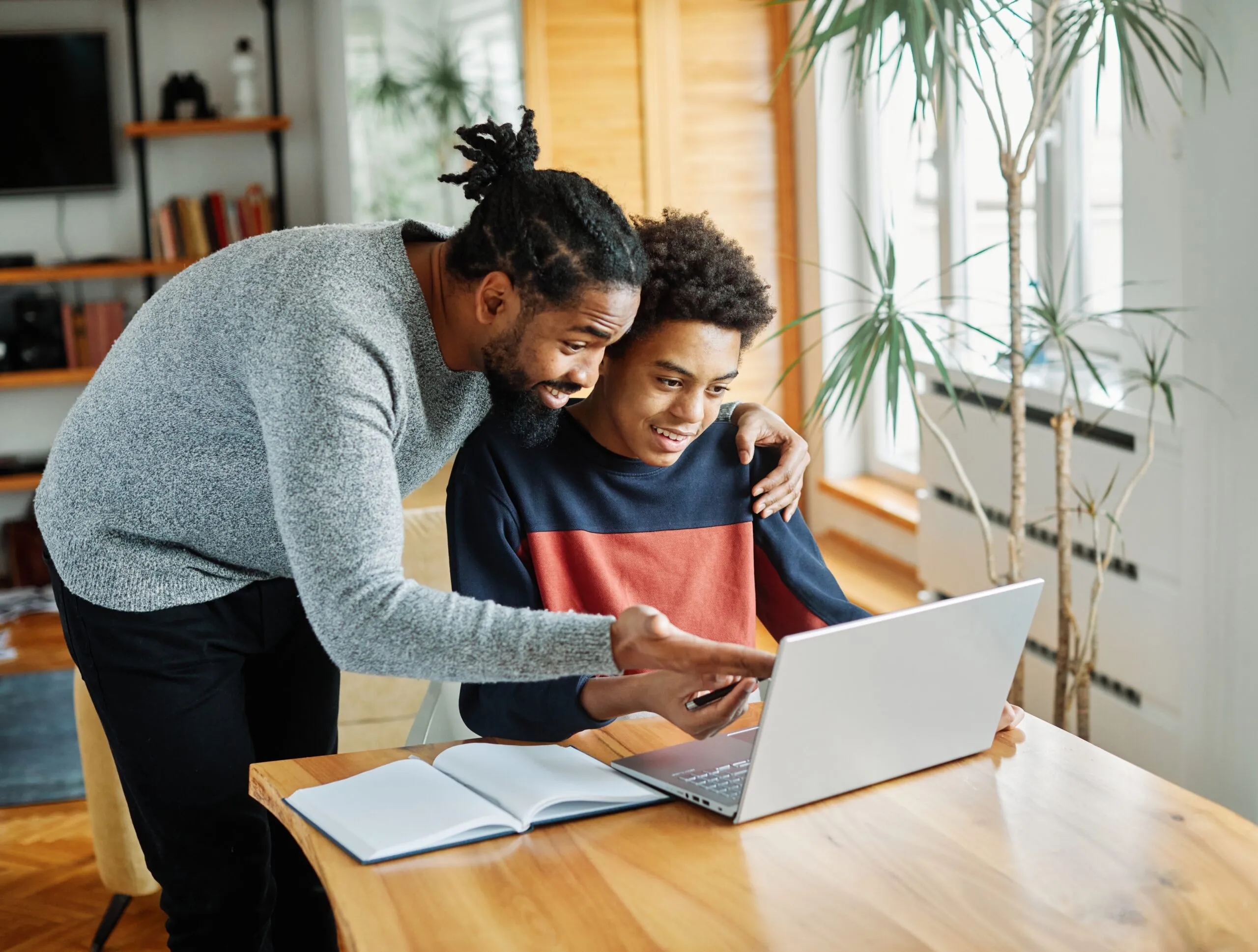 Father,And,Son,Doing,Homework,With,Laptop,At,Home.,Father